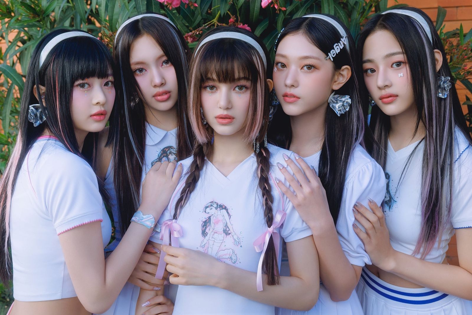 Members of the K-pop group NewJeans posing together